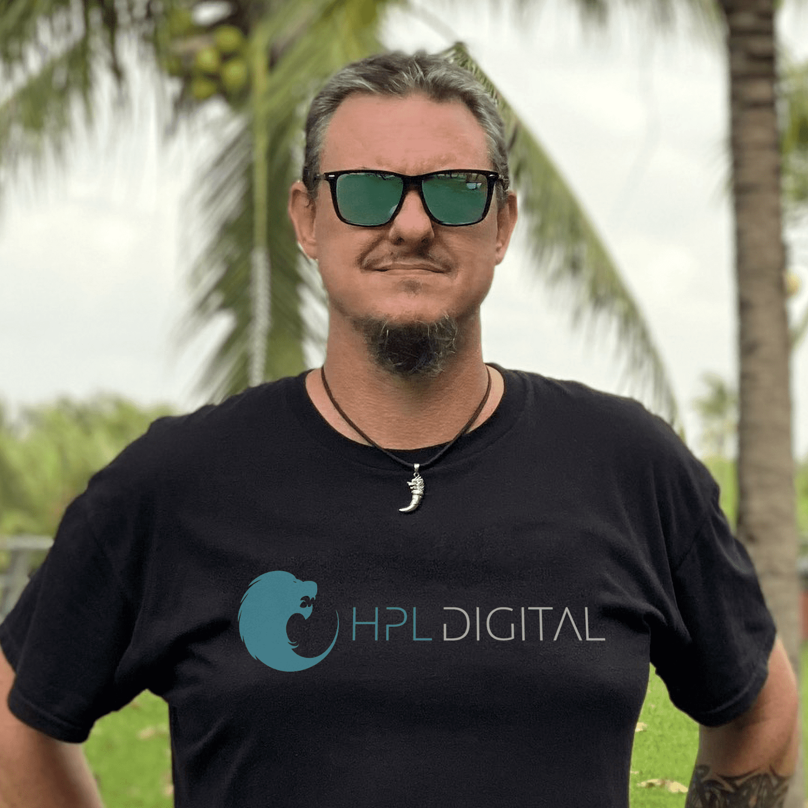 Founder of HPL Digital wearing a black tee with the HPL Digital logo